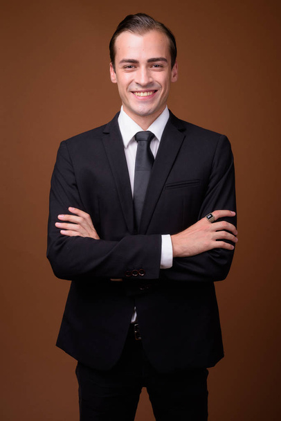 Portrait of young happy Caucasian businessman smiling - Φωτογραφία, εικόνα