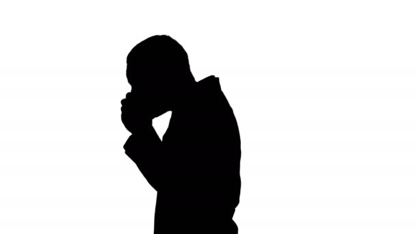 Silhouette Walking doctor putting on mask and cap. - Materiał filmowy, wideo