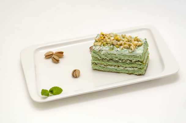 Pistachio cake on white background.  - Foto, Imagen