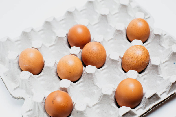 Brown chicken rustic eggs in a carton of eggs - Фото, зображення