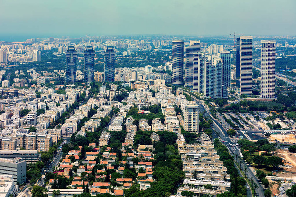 Aerial view of residential buildings and modern office towers in Tel Aviv, Israel. - Фото, изображение