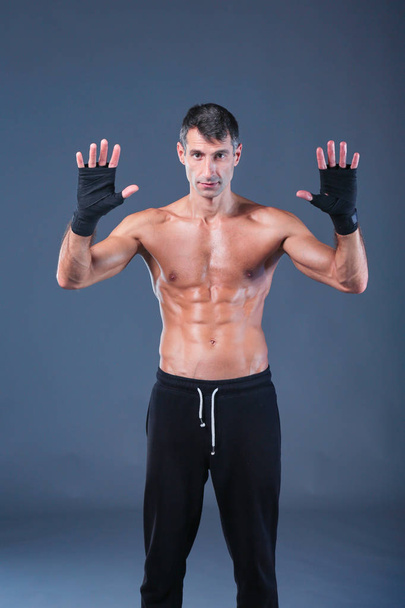 portrait of hand wrapping half nude boxer. Personal fitness instructor. Personal training. - Foto, Imagem