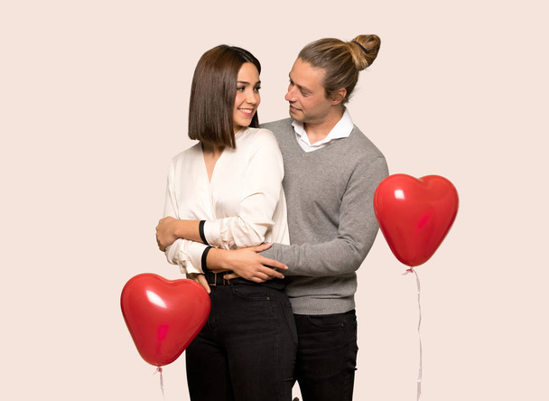 Happy couple in valentine day over isolated background - Photo, Image