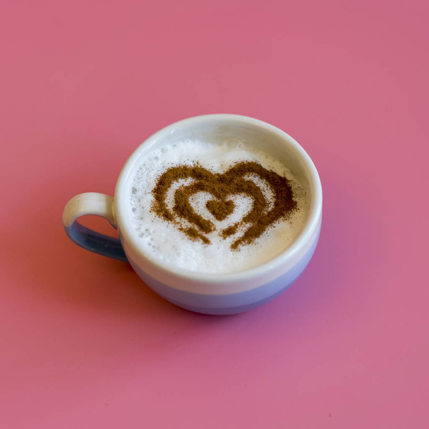 Heart Shape Coffee Cup Concept isolated on pink background. love cup , heart drawing on latte art coffee. square - Photo, Image