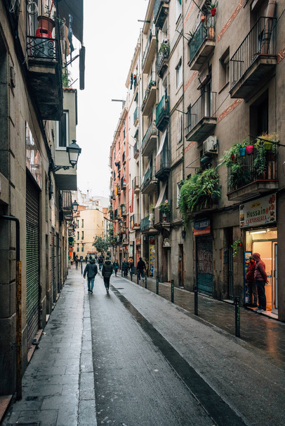 Narrow street in the Gothic Quarter, Barcelona, Spain - Fotó, kép