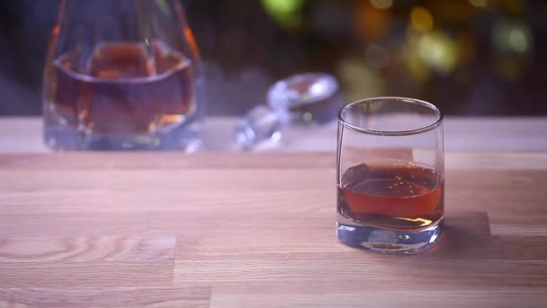 whiskey ice glass smoke wooden background hd footage  - Felvétel, videó