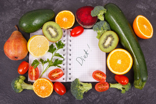 Notepad and fresh ripe fruits with vegetables containing natural vitamins and minerals, slimming and diet concept - Foto, Imagem