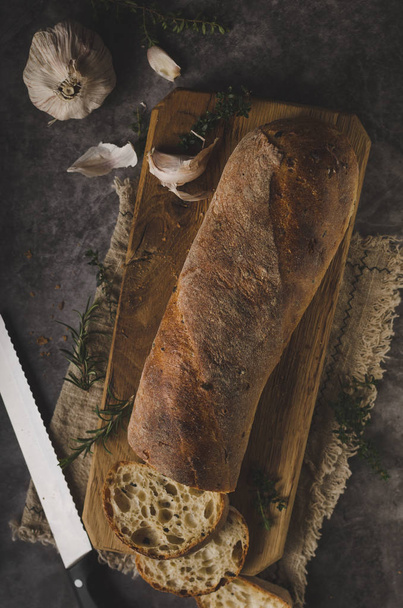 Fresh pastry baguette with herbs, garlic from home bakery - Foto, Imagem