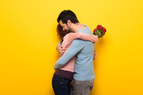 Couple in valentine day with flowers - Foto, imagen