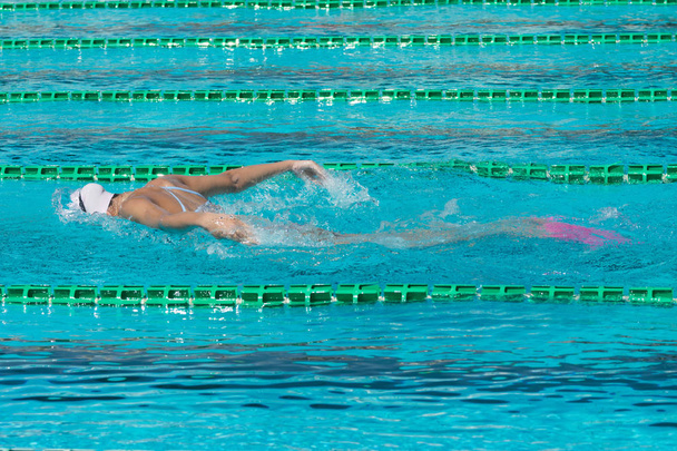 swimmer in lane pool, woman in water - 写真・画像