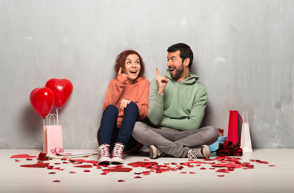 Couple in valentine day intending to realizes the solution while lifting a finger up - Photo, Image