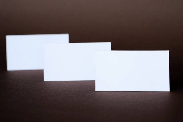 Business cards on a dark background; close-up shot - Foto, imagen