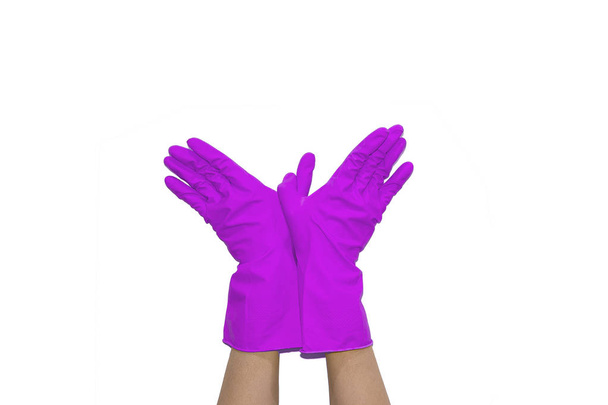 Two palms in purple gloves show bird gesture on white isolated background - Fotó, kép