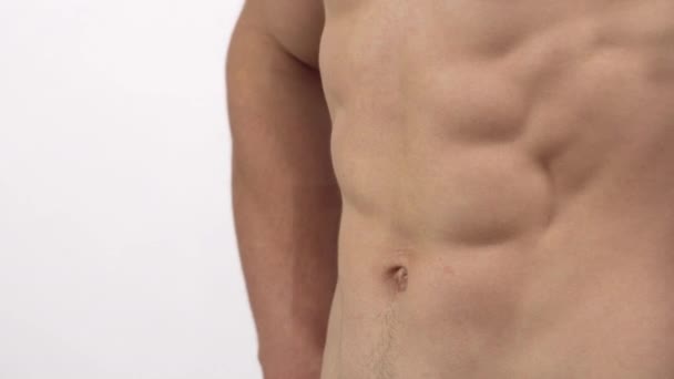 Ripped shirtless muscular men flexing his six-pack isolated - Footage, Video