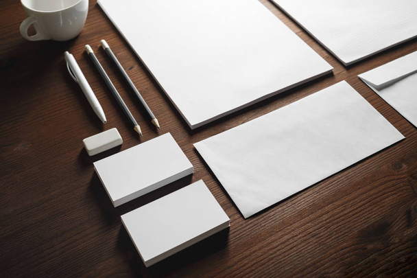 Photo of blank stationery set on wooden background. Corporate identity mock up for placing your design. - 写真・画像