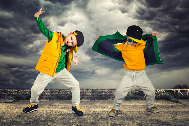 Two brothers dancing break dance.Hip-hop style.The cool kids.Children's fashion. - Photo, Image