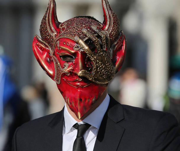 Venice, VE, Italy - February 5, 2018: Devil Mask at the Venice Carnival in Saint Mark Square - Photo, Image