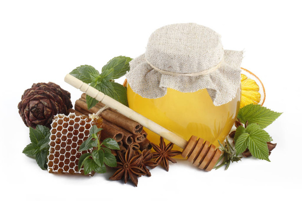 Sweet honey with spices isolated on white background  - Photo, Image