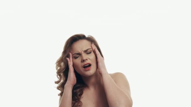 portrait of headache woman on white background - Кадри, відео