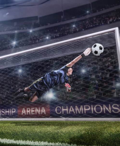 goalkeeper jumping for the ball on football match - Photo, Image