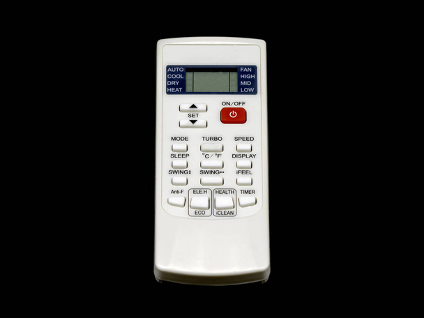 A remote control for air conditioner isolated on black background. - Photo, Image