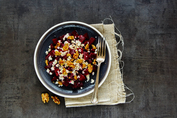 Healthy roasted beetroot salad with walnut and feta cheese flat lay - Photo, Image