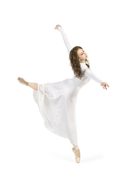 A girl in a white dress dancing ballet. Studio shot on white background, isolated image. - Valokuva, kuva