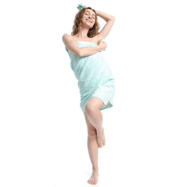 Beautiful woman in green towel roller antiperspirant in hand beauty body care - Φωτογραφία, εικόνα