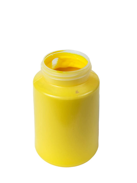 Yellow acrylic paint in the plastic container, isolated white background - Foto, imagen