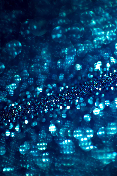Deep blue glitter magic background. Defocused light and free focused place for your design. - Foto, Imagen