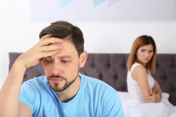 Couple with relationship problems ignoring each other in bedroom - Fotó, kép