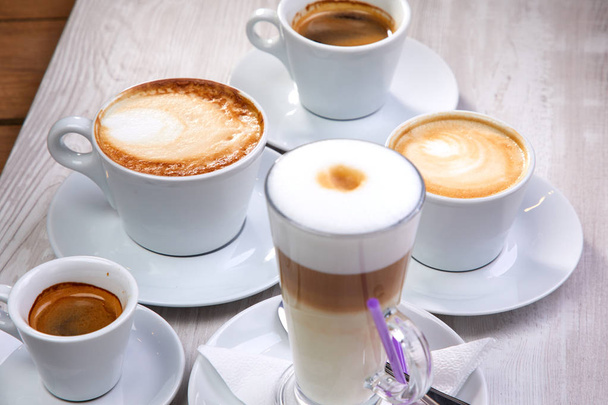 set of coffee drinks on white wooden background - Foto, Bild
