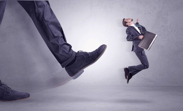 Foot kicking, businessman flying - Фото, зображення