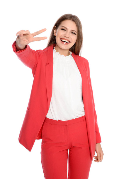 Young businesswoman celebrating victory on white background - Valokuva, kuva