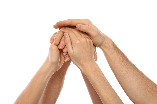 Young people holding hands together on white background, closeup. Team victory concept - Foto, immagini