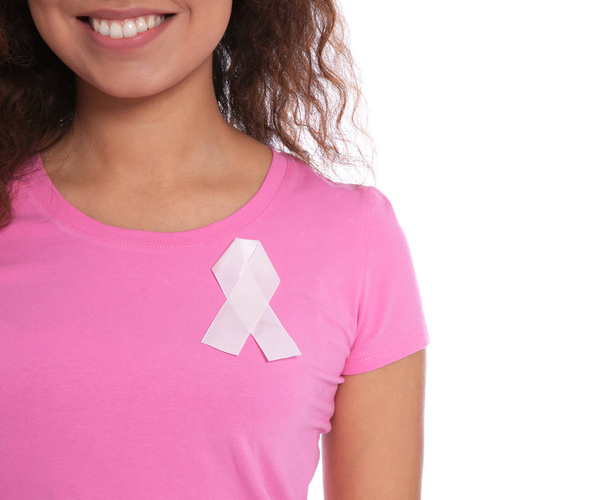 African-American woman with silk ribbon on white background, closeup. Breast cancer awareness concept - Foto, Imagem