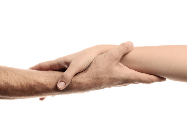 Man and woman holding hands on white background, closeup. Help and support concept - Fotoğraf, Görsel