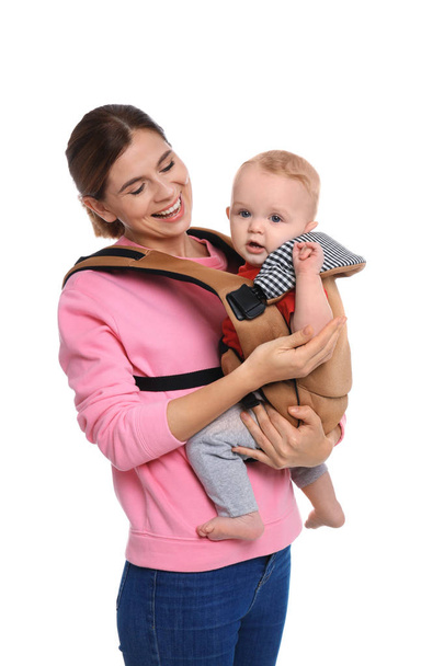 Woman with her son in baby carrier on white background - Photo, image