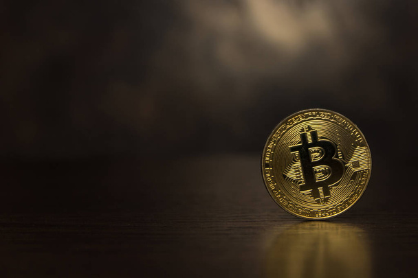  golden bitcoin stand on dark background - Fotoğraf, Görsel
