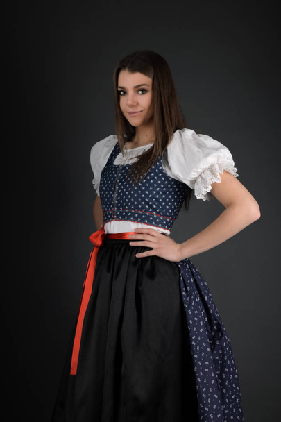 Young beautiful slovak woman in traditional costume  - Foto, imagen