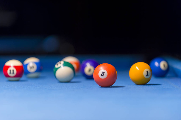 Billiard balls on pool blue table - sport background - Фото, изображение
