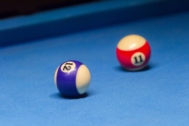 Colorful billiards balls. Billiard ball at blue table. Colorful American pool snooker balls background. American Billiard in bar. Close up Billiard balls. Bar game. Billiard table game. Colorful ball - Photo, Image