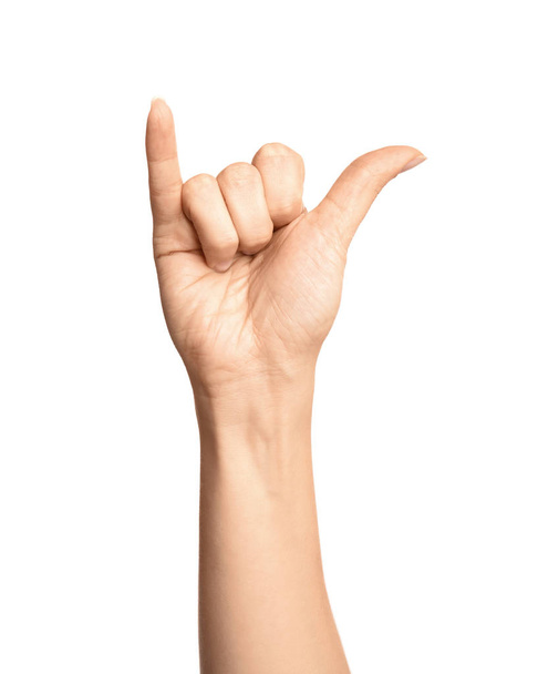 Woman showing Y letter on white background, closeup. Sign language - Foto, afbeelding