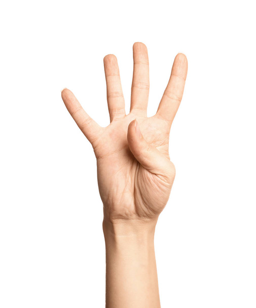 Woman showing number four on white background, closeup. Sign language - Valokuva, kuva