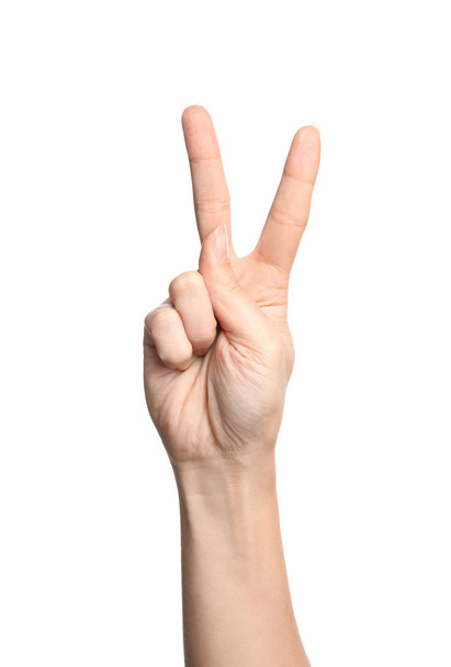 Woman showing V letter on white background, closeup. Sign language - Foto, Bild