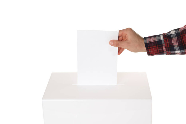 Man putting his vote into ballot box on white background, closeup - Foto, Bild