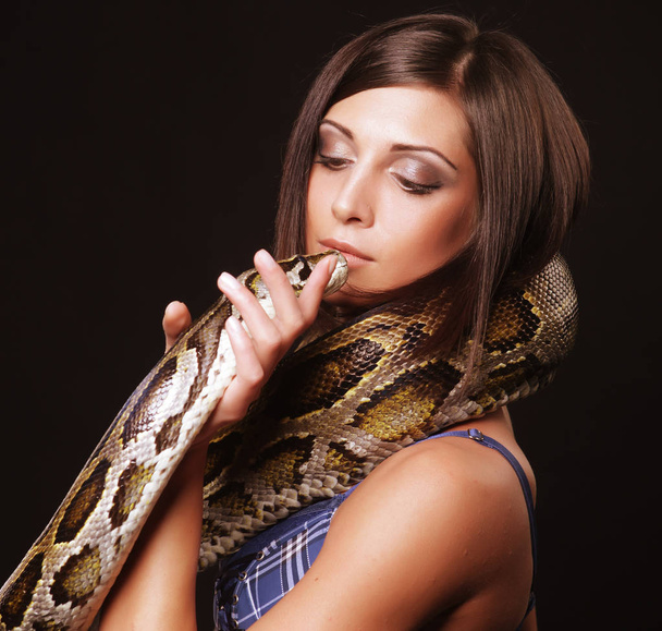 sexy brunette holding python - Photo, Image