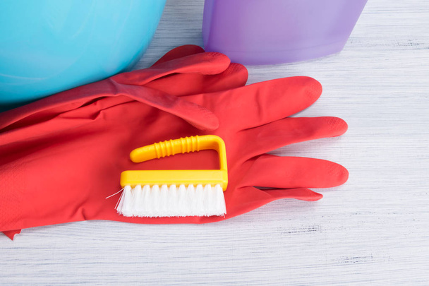 cleaning items, on the table, rubber gloves, brush, bucket - Photo, Image