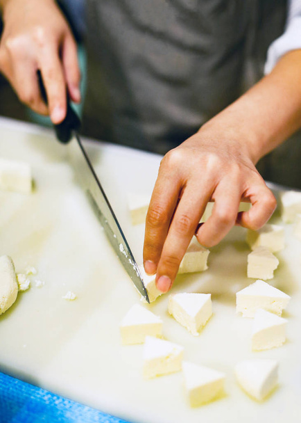 Chef slicing tofu for cooking, Chef cooking food in the kitchen, Fresh tofu - Fotografie, Obrázek