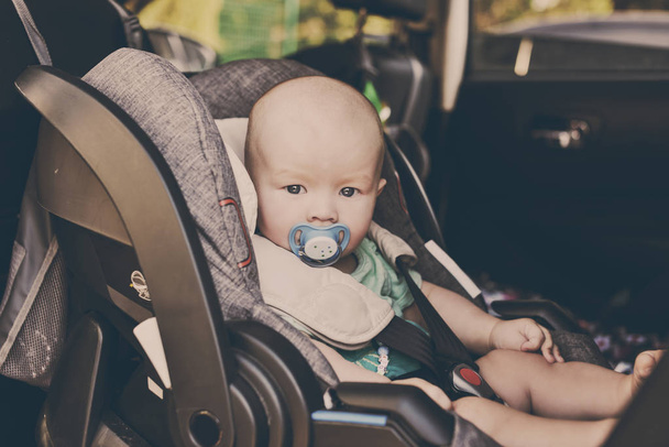 baby boy in the car seat in summer - Photo, image